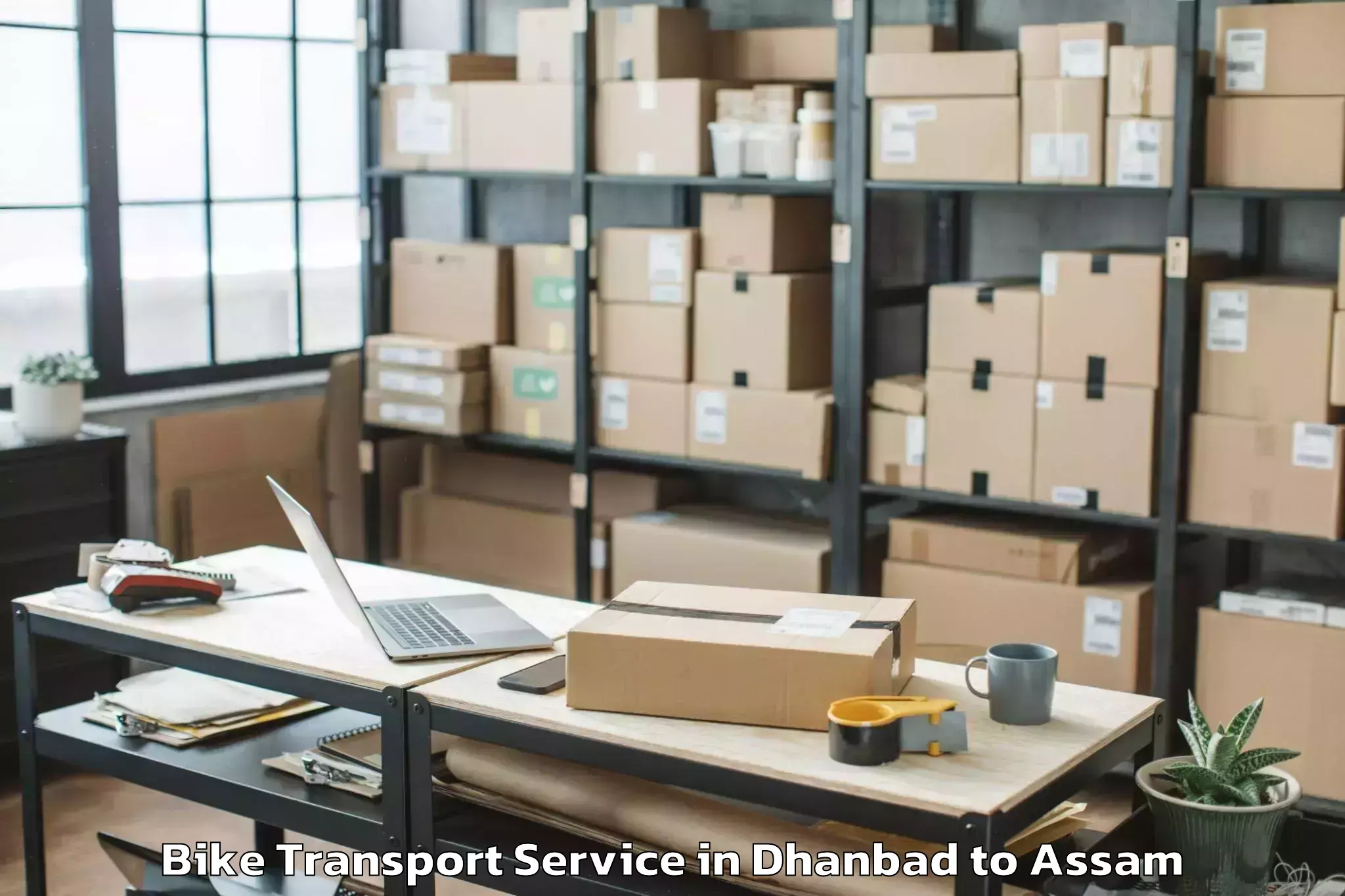 Professional Dhanbad to Udharbond Bike Transport